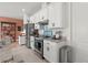 Modern kitchen featuring white cabinetry, granite counters, and stainless steel appliances for stylish cooking at 2928 Marlberry Ln, Clermont, FL 34714