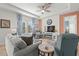 Cozy living room featuring natural light, comfortable seating, and modern decor for relaxed living at 2928 Marlberry Ln, Clermont, FL 34714