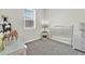Bright and airy bedroom featuring neutral decor and a large window allowing for natural light at 31760 Broadwater Ave, Leesburg, FL 34748