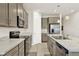 Bright kitchen boasts stainless steel appliances, stone countertops, and ample cabinet storage at 31760 Broadwater Ave, Leesburg, FL 34748