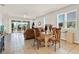Open-concept living room with tile floors and sliding glass doors that open to an outdoor patio at 31760 Broadwater Ave, Leesburg, FL 34748