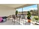 Relaxing screened patio with bar-height outdoor dining set and lush decorative plants at 31760 Broadwater Ave, Leesburg, FL 34748