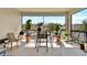 Spacious screened patio with an outdoor dining set and beautiful views of the backyard at 31760 Broadwater Ave, Leesburg, FL 34748