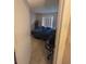 View of the bedroom with tile floors, a window with blinds, and a closet at 3306 Sandy Shore Ln, Kissimmee, FL 34743