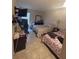 Bedroom with tile floor, two beds, television, and a window with curtains at 3306 Sandy Shore Ln, Kissimmee, FL 34743