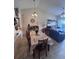 Spacious open-plan dining room adjacent to living room at 3306 Sandy Shore Ln, Kissimmee, FL 34743