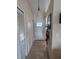 Welcoming entryway with tiled floor, closet and modern light fixture at 3306 Sandy Shore Ln, Kissimmee, FL 34743