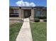 Charming single-story home with inviting entrance and manicured lawn at 3306 Sandy Shore Ln, Kissimmee, FL 34743