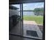 View of the lake from the screened in patio with paved patio area at 3306 Sandy Shore Ln, Kissimmee, FL 34743