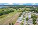 Scenic aerial view of community homes bordering lush golf course, lakes, and wooded areas at 33417 Pennbrooke Pkwy, Leesburg, FL 34748