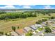 Scenic aerial shot of residential homes bordering a beautiful golf course and a lake at 33417 Pennbrooke Pkwy, Leesburg, FL 34748