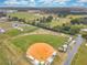 An aerial view of a baseball field, RV parking, and a community garden at 33417 Pennbrooke Pkwy, Leesburg, FL 34748
