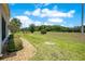 Large backyard with green grass and manicured landscaping, perfect for outdoor enjoyment at 33417 Pennbrooke Pkwy, Leesburg, FL 34748