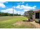 Scenic view of a well-maintained lawn and golf course, perfect for outdoor activities at 33417 Pennbrooke Pkwy, Leesburg, FL 34748