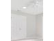 Neutral bedroom features a ceiling fan and double door closet at 33417 Pennbrooke Pkwy, Leesburg, FL 34748