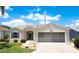 Beautiful one-story home featuring a well-kept lawn, screened garage, and classic curb appeal at 33417 Pennbrooke Pkwy, Leesburg, FL 34748