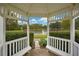 Picturesque view of a serene lake framed by a gazebo and lush greenery at 33417 Pennbrooke Pkwy, Leesburg, FL 34748