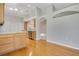 Kitchen with wood floors and view into carpeted living room at 33417 Pennbrooke Pkwy, Leesburg, FL 34748
