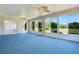 Enclosed lanai with ceiling fans and views of the backyard at 33417 Pennbrooke Pkwy, Leesburg, FL 34748