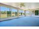 Open lanai boasts bright natural light and serene backyard views at 33417 Pennbrooke Pkwy, Leesburg, FL 34748