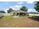 Wide view of the backyard with a privacy fence and plenty of space to make it your own at 3677 Park Green Ct, Tavares, FL 32778