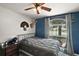 Inviting bedroom with a window view, stylish decor, and cozy ambiance at 3677 Park Green Ct, Tavares, FL 32778