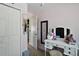 Bedroom featuring closet, desk, mirror, and light pink walls at 3677 Park Green Ct, Tavares, FL 32778