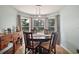 Cozy dining area with a round table and views of the outdoor scenery at 3677 Park Green Ct, Tavares, FL 32778