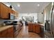 Kitchen with modern appliances and a seamless view of the dining space at 3677 Park Green Ct, Tavares, FL 32778