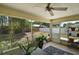 Enclosed patio with tiled floor and view of the backyard at 3677 Park Green Ct, Tavares, FL 32778