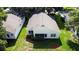 An aerial view of the backyard shows the home's location in the neighborhood with a patio at 3718 Westerham Dr, Clermont, FL 34711