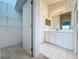 This bathroom has a double sink vanity with a framed mirror and great lighting at 3718 Westerham Dr, Clermont, FL 34711