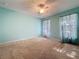 Bright bedroom with sheer curtains over windows, ceiling fan and neutral carpet at 3718 Westerham Dr, Clermont, FL 34711