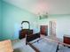 Bright bedroom offering neutral carpet, light-aqua walls, and views into ensuite bathroom at 3718 Westerham Dr, Clermont, FL 34711