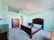 Large bedroom with high ceilings, neutral carpet and light-aqua walls at 3718 Westerham Dr, Clermont, FL 34711