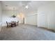 Spacious living room with a chandelier over the dining table and a ceiling fan at 3718 Westerham Dr, Clermont, FL 34711