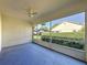 Enclosed screened porch with a ceiling fan, offering an airy retreat with views of the backyard at 3718 Westerham Dr, Clermont, FL 34711