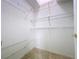 Walk-in closet with carpet flooring and white wired shelving at 3718 Westerham Dr, Clermont, FL 34711