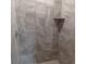 Close up of new, tiled shower with built in shelf at 435 Woodview Dr, Tavares, FL 32778