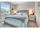 Cozy bedroom featuring a large window for natural light and stylish nightstands on each side at 4716 Heritage Trl, Leesburg, FL 34748