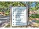 Community signage with directions to Village Tavern, Restaurant, Pro Shop, and other community features at 4716 Heritage Trl, Leesburg, FL 34748