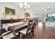 The dining room provides sightlines to the kitchen and living room in an open concept living space at 4716 Heritage Trl, Leesburg, FL 34748