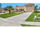 Charming single-story home with a well-manicured lawn and a long driveway at 4716 Heritage Trl, Leesburg, FL 34748