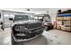 Clean garage features a new model Jeep Grand Cherokee, golf cart, and organized storage at 4716 Heritage Trl, Leesburg, FL 34748