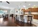 Open-concept kitchen with a large island, stainless steel appliances, and seamless flow into the adjacent dining area at 4716 Heritage Trl, Leesburg, FL 34748