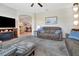 Comfortable living room features a fireplace and neutral colors that create a relaxing atmosphere at 4716 Heritage Trl, Leesburg, FL 34748