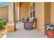 An inviting front porch features two comfortable wicker chairs and a cozy ambiance at 4716 Heritage Trl, Leesburg, FL 34748