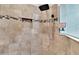 Nicely tiled shower with rainfall shower head and soap nook provides a spa-like experience at 4716 Heritage Trl, Leesburg, FL 34748