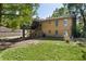 Back of the two-story home, with a lawn and porch at 5581 Sw 197Th Ter, Dunnellon, FL 34431