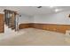 Large basement with wood-burning stone fireplace and spiral staircase to the upper level at 5581 Sw 197Th Ter, Dunnellon, FL 34431